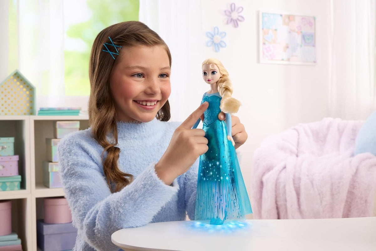 Mattel Muñeca Elsa cantante de Frozen de Disney con luces y música,...